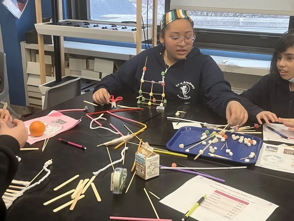 Students building a structure during an engineering activity